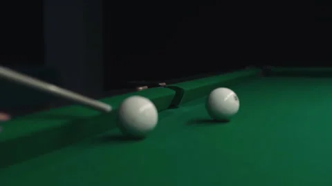 Playing billiards on a green table in a dark room. Stock Footage 241179320