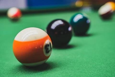Playing billiards at a pool hall Stock Photos