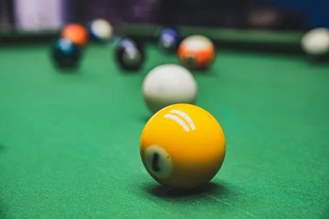 Playing billiards at a pool hall Stock Photos