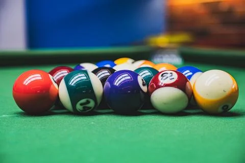 Playing billiards at a pool hall Stock Photos