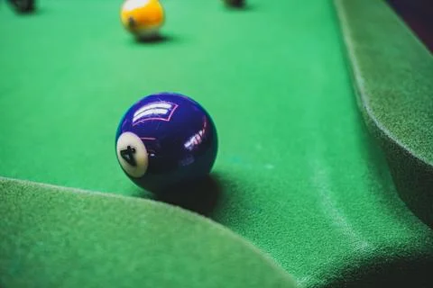 Playing billiards at a pool hall Stock Photos