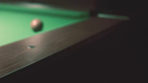 Playing Billiards Under Dim Lights in a Cozy Game Room Stock Footage 347019061