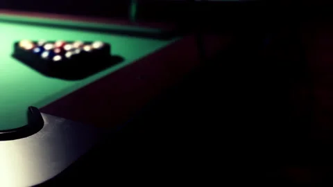 Playing Billiards on a Vibrant Green Table in a Cozy Game Room at Night Stock Footage 344910182