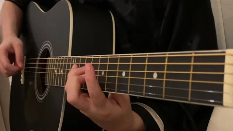 Playing a black guitar Video stock 139017709