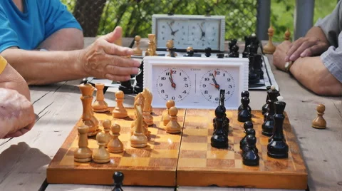 Playing blitz chess in the Park on a summer day Stock Footage 64789208