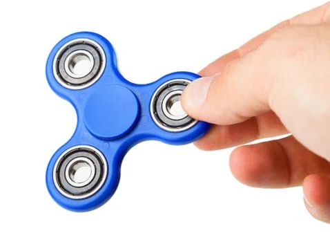 Playing with a blue Fidget Spinner Foto stock