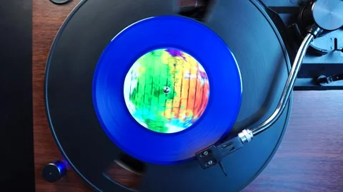 Playing Blue Single Vinyl Record on Turntable, Top Down View Stock Footage 325708173