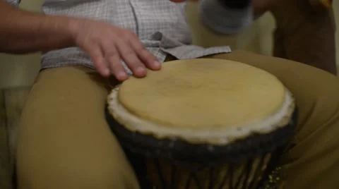 Playing Bongo Drum Close Up - Hand Tapping A Bongo Drum In Close Stock Footage 66554004