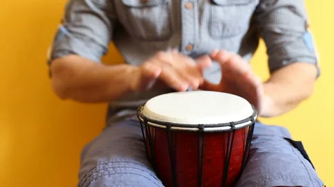 Playing Bongo drum close up HD stock footage. Hand tapping a Bongo drum in close Stock Footage 61175982