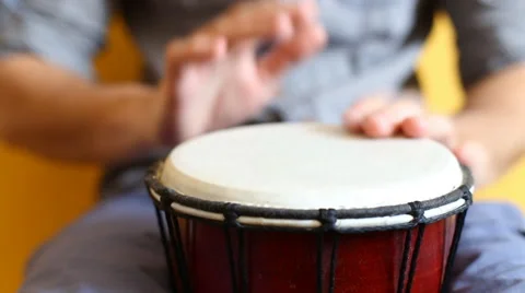 Playing Bongo drum close up HD stock footage. Hand tapping a Bongo drum in close Stock Footage 61176012