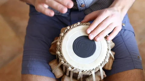 Playing Bongo drum close up HD stock footage. Hand tapping a Bongo drum in close Stock-Footage 61176042