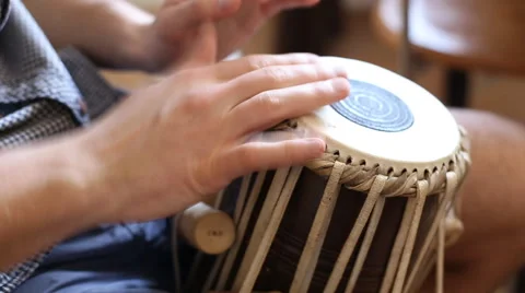 Playing Bongo drum close up HD stock footage. Hand tapping a Bongo drum in close Stock Footage 61176142