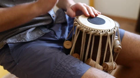 Playing Bongo drum close up HD stock footage. Hand tapping a Bongo drum in close Stock Footage 61176184