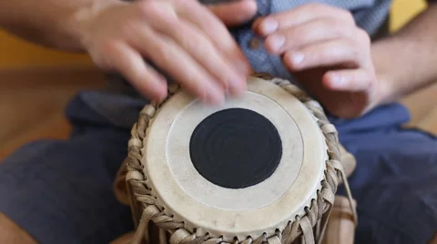 Playing Bongo drum close up HD stock footage. Hand tapping a Bongo drum in close Stock Footage 61176213