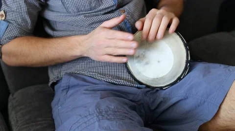 Playing Bongo drum close up HD stock footage. Hand tapping a Bongo drum in close Stock Footage 61176449