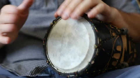 Playing Bongo drum close up HD stock footage. Hand tapping a Bongo drum in close Stock Footage 61176594
