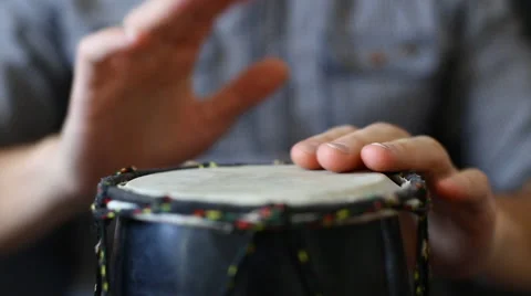 Playing Bongo drum close up HD stock footage. Hand tapping a Bongo drum in close Stock Footage 61176641
