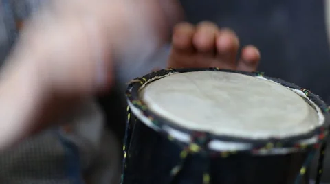 Playing Bongo drum close up HD stock footage. Hand tapping a Bongo drum in close Stock Footage 61176824