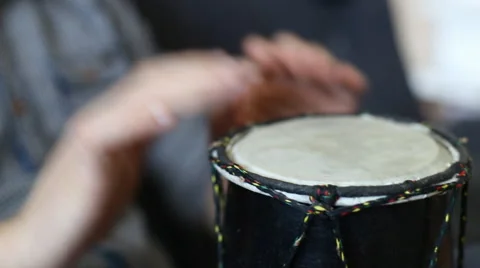 Playing Bongo drum close up HD stock footage. Hand tapping a Bongo drum in close Stock Footage 61176905