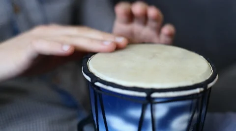 Playing Bongo drum close up HD stock footage. Hand tapping a Bongo drum in close Stock Footage 61176975