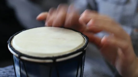 Playing Bongo drum close up HD stock footage. Hand tapping a Bongo drum in close Stock Footage 61177049