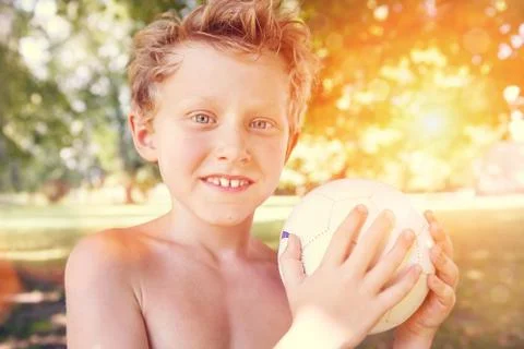 Playing boy with ball Stock Photos