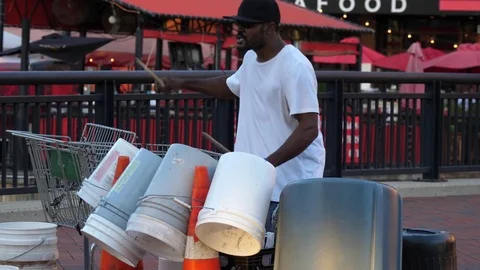 Playing bucket and trash can drums in Baltimore Stock Footage 81890338
