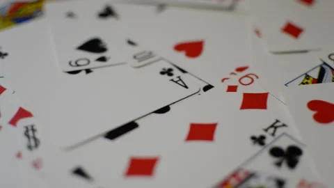 Playing card background on a table. camera motion on playing card deck. 스톡 동영상 230249924