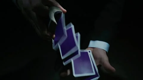 Playing card flies from hand to hand in close-up Stock-Footage 145116216