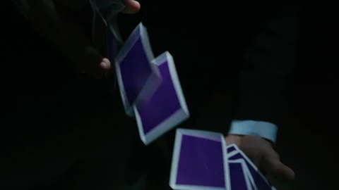 Playing card flies from hand to hand in close-up Stock-Footage 145116245