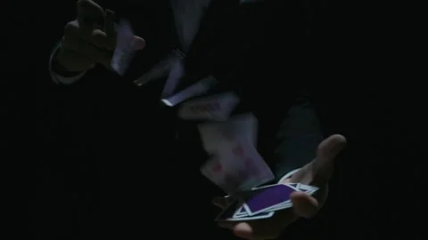 Playing card flies from hand to hand in close-up Stock Footage 153435910