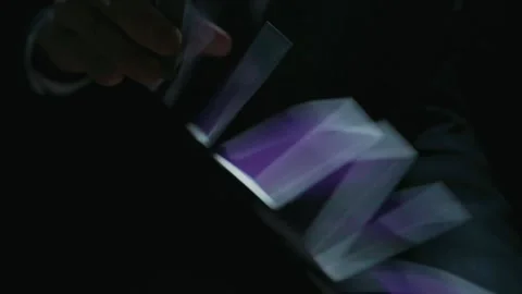Playing card flies from hand to hand in close-up Stock Footage 153435926