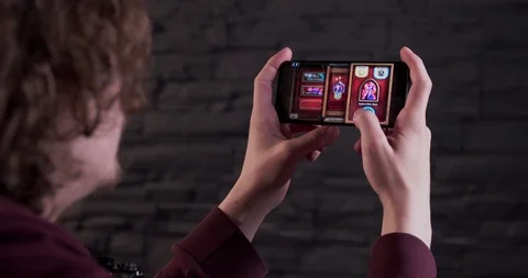 Playing card game on a mobile phone Stock Footage 111007903