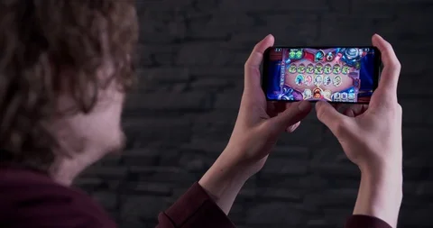 Playing card game on a smartphone Stock Footage 111006604