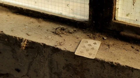 A playing card left on the old dusty wall Stock Footage 89887074