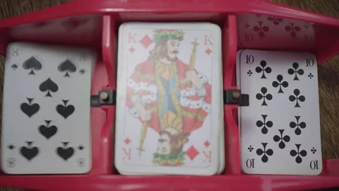 Playing card shuffler distributes the cards to the left and to the right Stock Footage 98414686