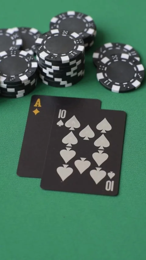 Playing cards and chips on a green cloth, a gambling game of blackjack or baccar Video stock 332267682