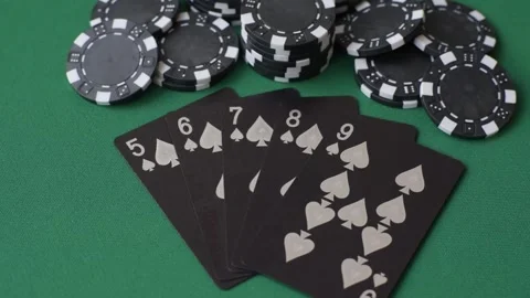 Playing cards and chips on a green cloth, a gambling game of poker. Cards and ch Stock Footage 332267701