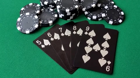 Playing cards and chips on a green cloth, a gambling game of poker. Cards and ch Stock Footage 332268031