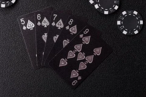 Playing cards and chips on a table, a gambling game of poker. Cards and chips Stock Photos