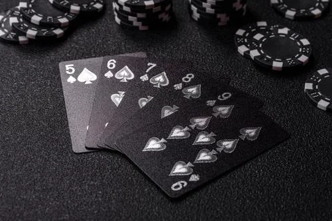 Playing cards and chips on a table, a gambling game of poker. Cards and chips Photos