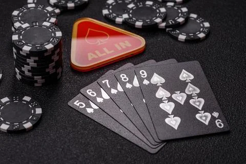 Playing cards and chips on a table, a gambling game of poker. Cards and chips Photos