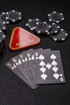 Playing cards and chips on a table, a gambling game of poker. Cards and chips Photos