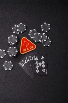 Playing cards and chips on a table, a gambling game of poker. Cards and chips Stock Photos