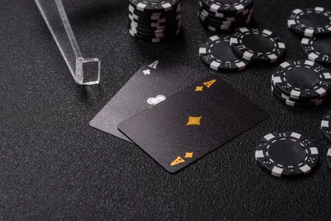 Playing cards and chips on a table, a gambling game of blackjack or baccara.. Photos