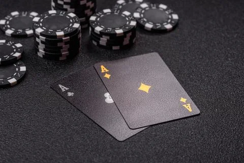 Playing cards and chips on a table, a gambling game of blackjack or baccara.. Photos