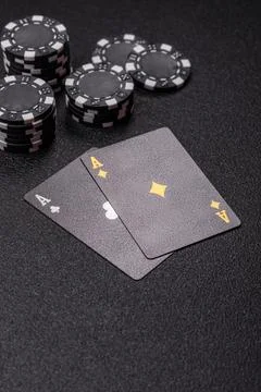 Playing cards and chips on a table, a gambling game of blackjack or baccara.. Photos