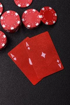 Playing cards and chips on a table, a gambling game of blackjack or baccara.. Photos