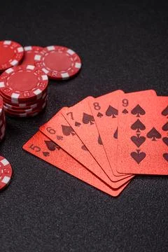 Playing cards and chips on a table, a gambling game of poker. Cards and chips Stock Photos