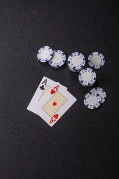 Playing cards and chips on a table, a gambling game of blackjack or baccara.. Photos
